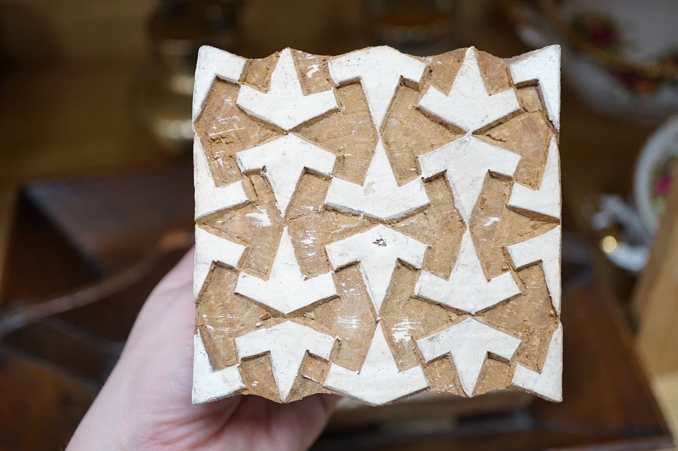 A wooden cutlery box, 42cm wide, together with carved patterned printing blocks, and other miscellaneous items